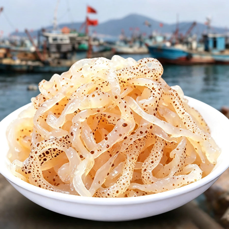 Bowl of translucent jellyfish strips on a harbour quay