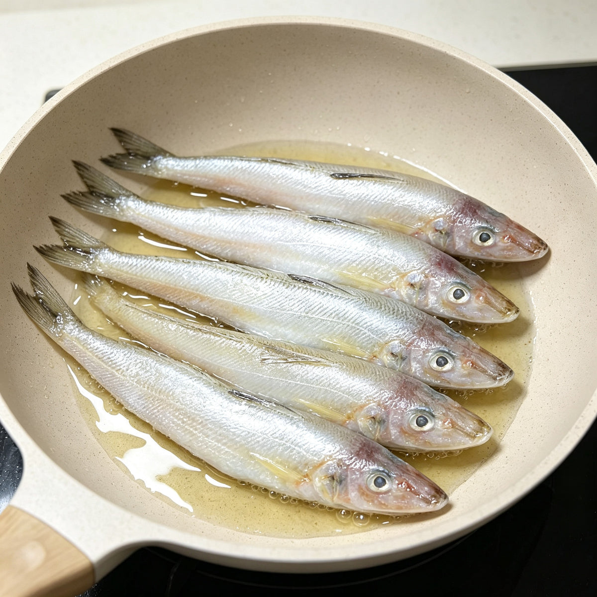Slender sillago laid out in a white pan ready to cook